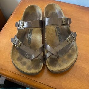 Birkenstock sandals. Still in great shape!  Bronzey brown color straps.